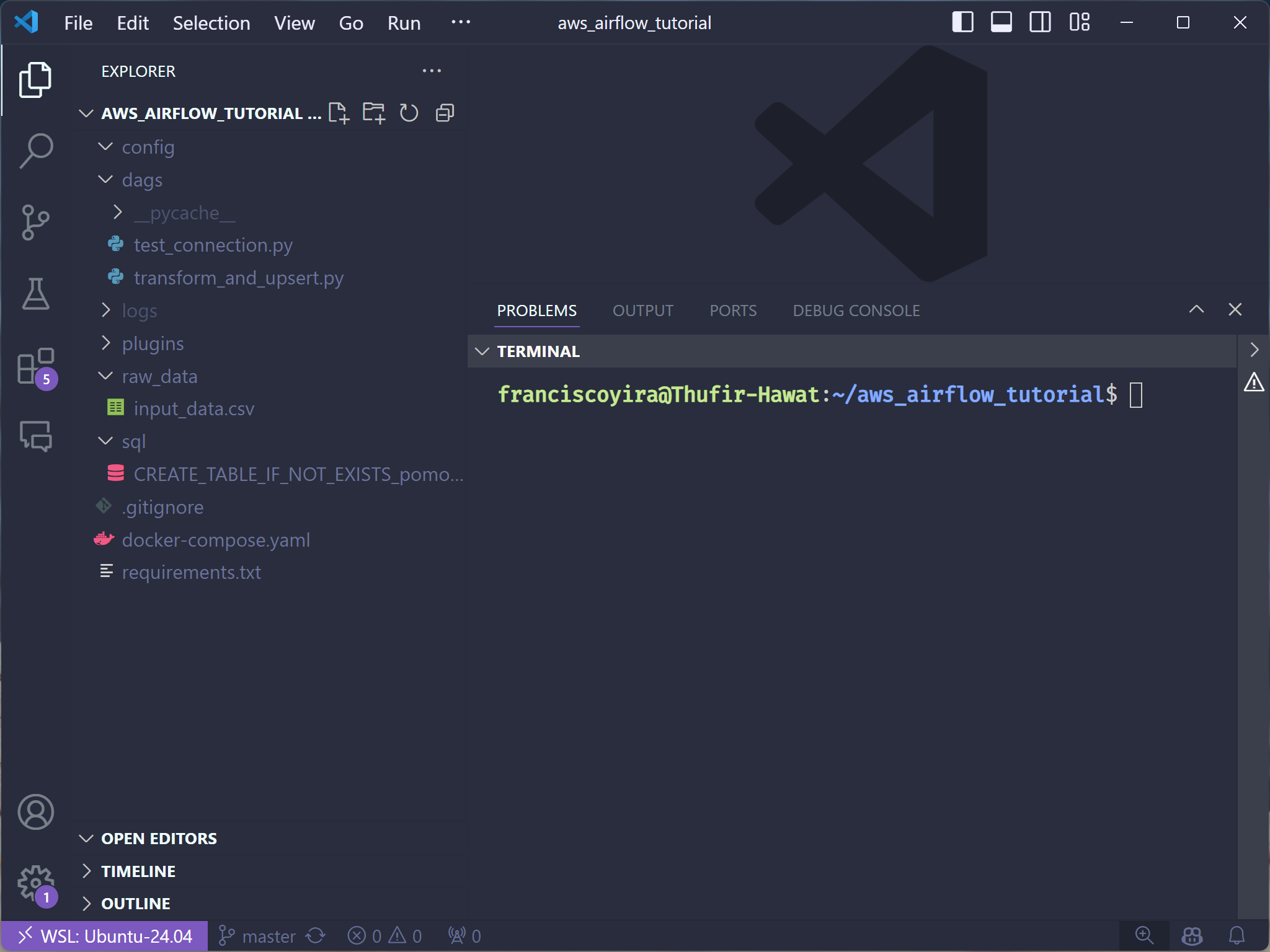 Visual Studio Code interface with a dark theme. The ‘EXPLORER’ panel displays files and folders for a project named ‘AWS AIRFLOW_TUTORIAL.’ The file structure includes folders like ‘config,’ ‘dags,’ and files such as ‘.gitignore,’ ‘docker-compose.yaml,’ and ‘requirements.txt.’ A terminal at the bottom shows the user prompt in the ‘aws_airflow_tutorial’ directory.